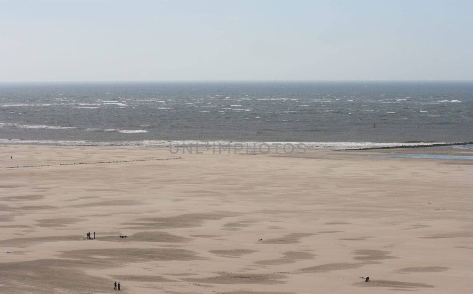 a long lonely sand beach, on the North Sea