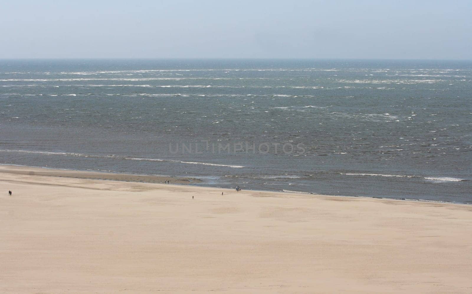 a long lonely sand beach, on the North Sea