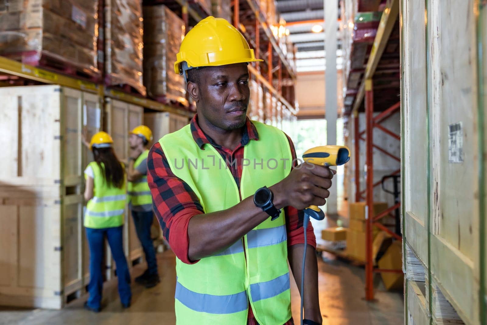 Portrait of african black warehouse worker hold hand scanner to do inventory work stock in distribution warehouse. Traceability FIFO LIFO inventory just in time and warehouse concept photo.