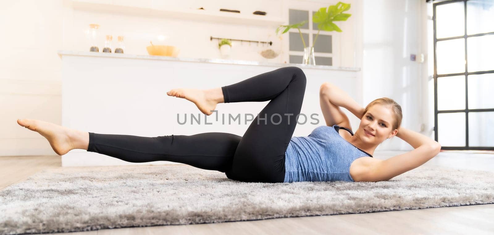 Panoramic White caucasian fit sporty woman doing yoga side plank in living room at home for mental health and meditation. Working out, fitness sport and healthy lifestyle concept.