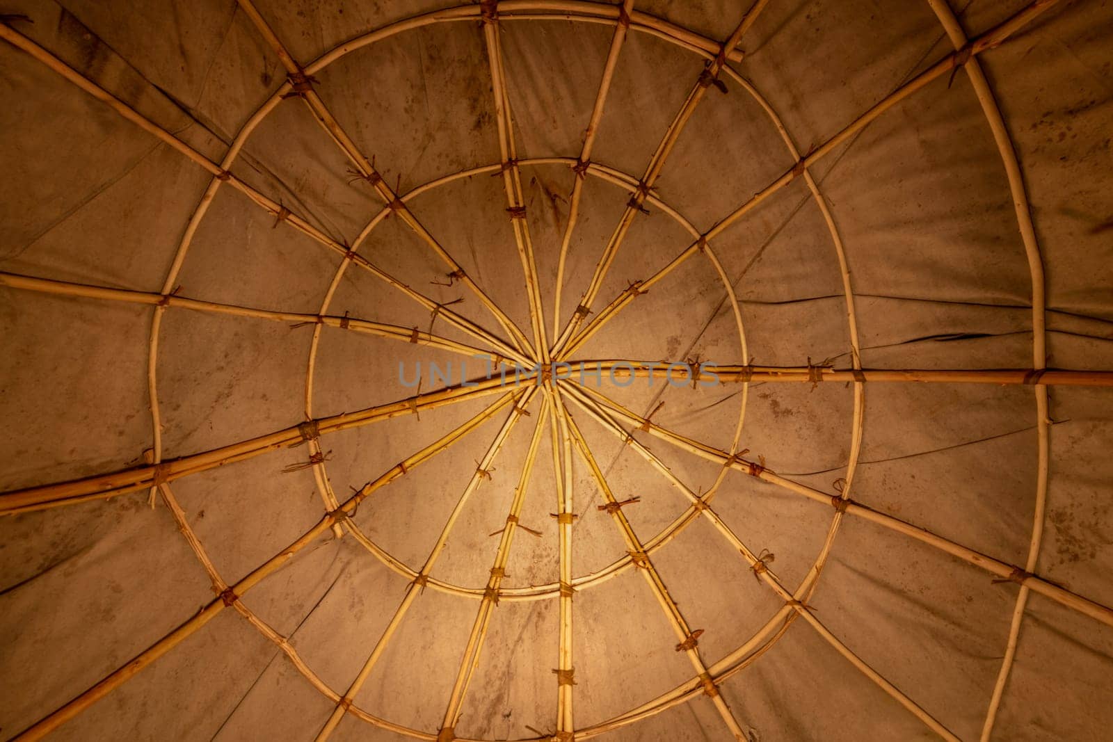Interior view of an Indian sweat lodge. Star-shaped willow sticks covered with fabric tarpaulin