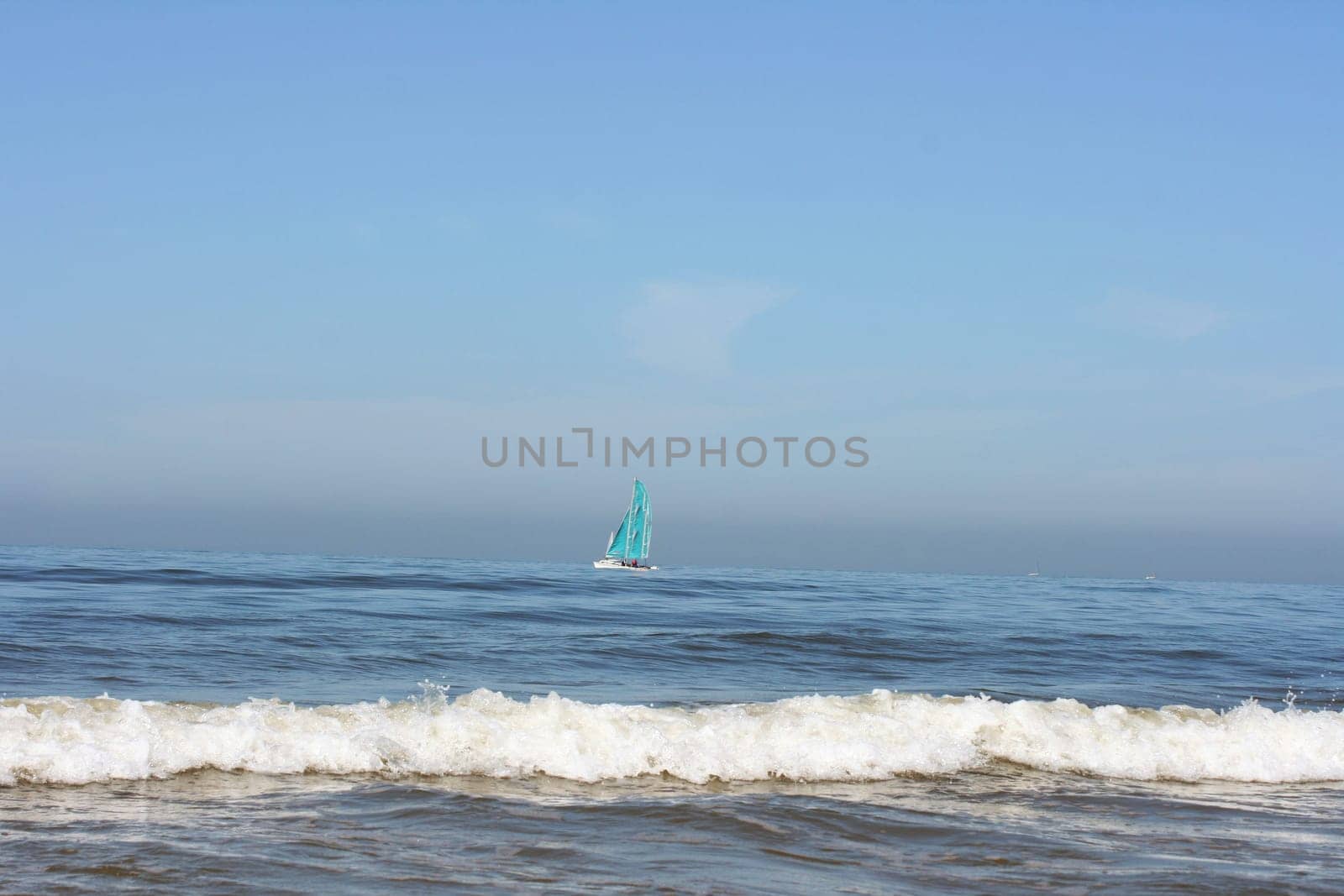 Waves of white foam Crown roll over the sea surface