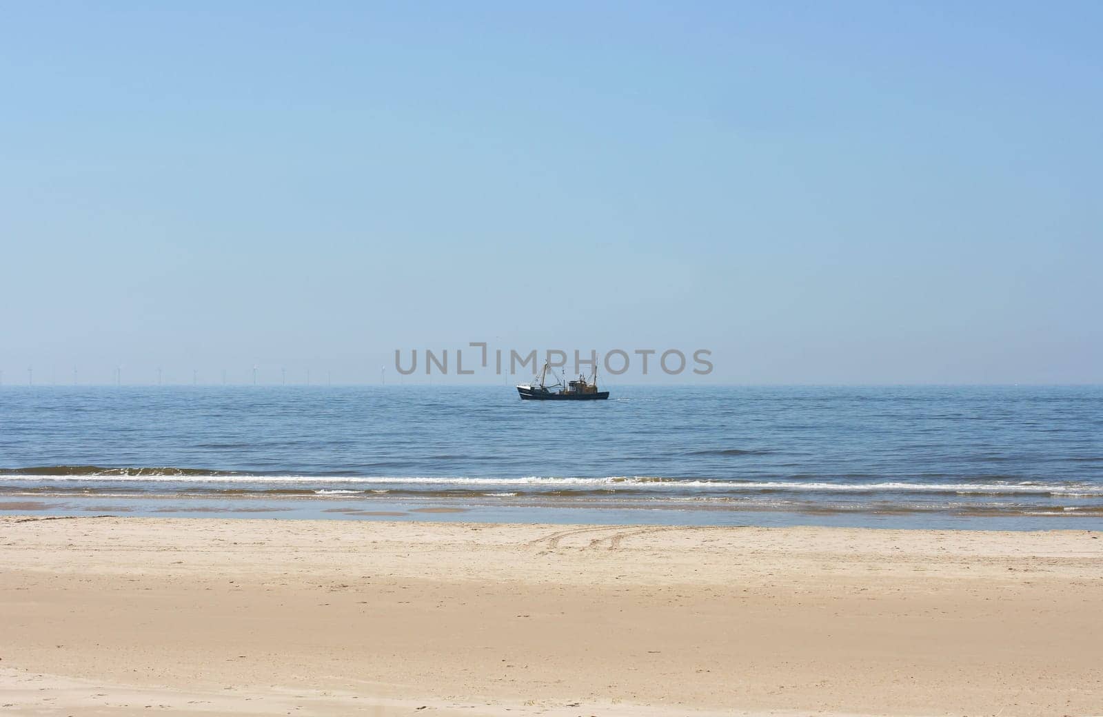 a long lonely sand beach, on the North Sea