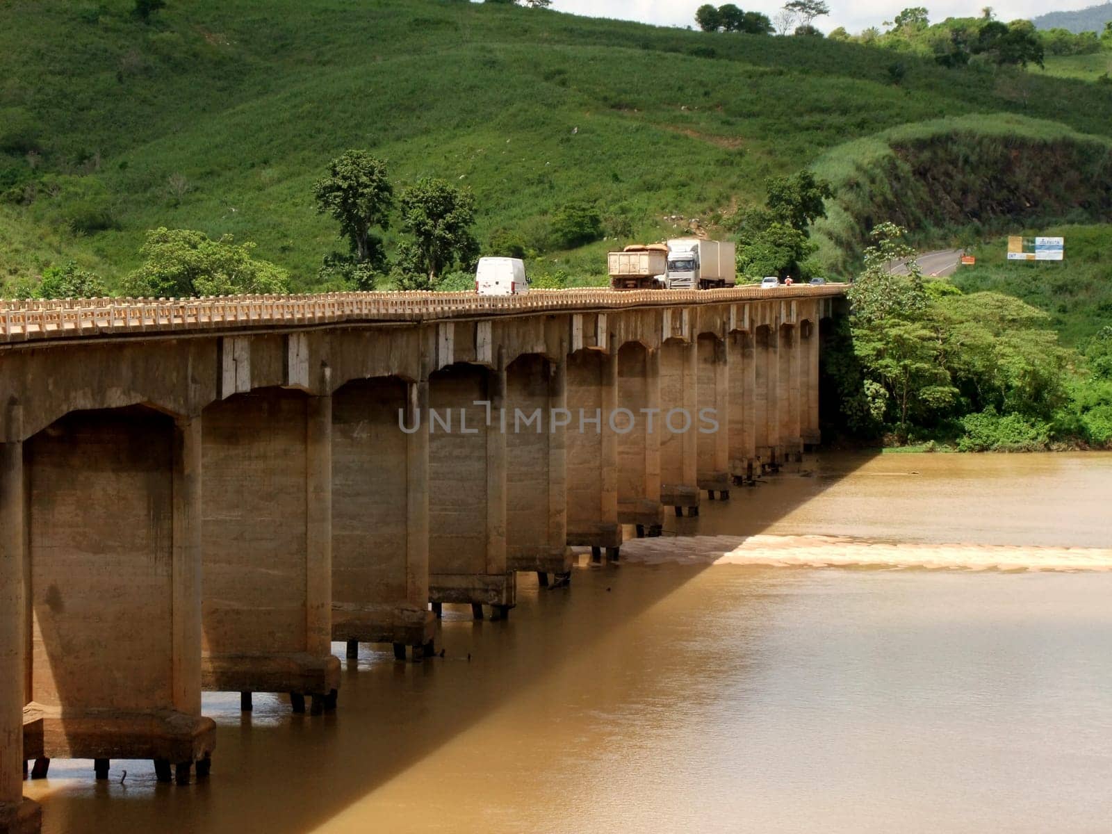 itapebi, bahia / brazil - april 5, 2011: vehicles are seen crossing the bridge over the Jequitinhonha River on the BR 101 road in the city of Itapebi, in southern Bahia.
