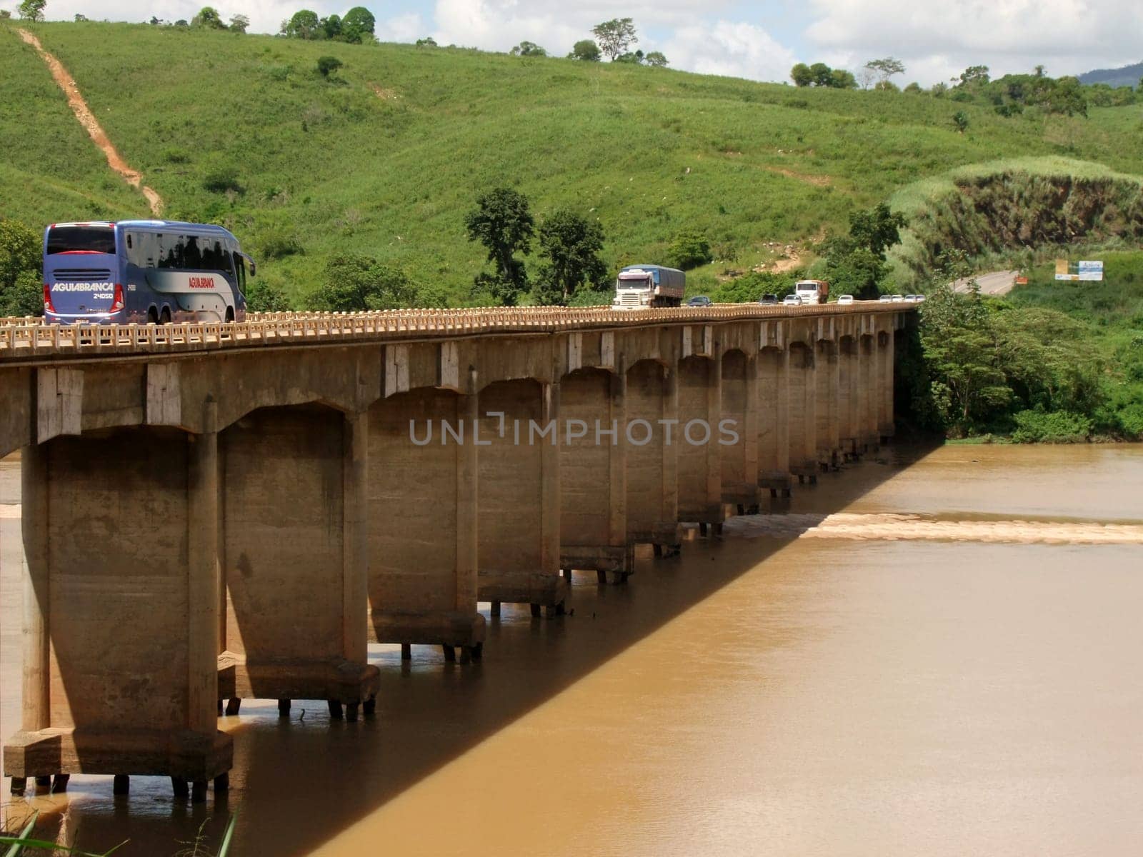 itapebi, bahia / brazil - april 5, 2011: vehicles are seen crossing the bridge over the Jequitinhonha River on the BR 101 road in the city of Itapebi, in southern Bahia.