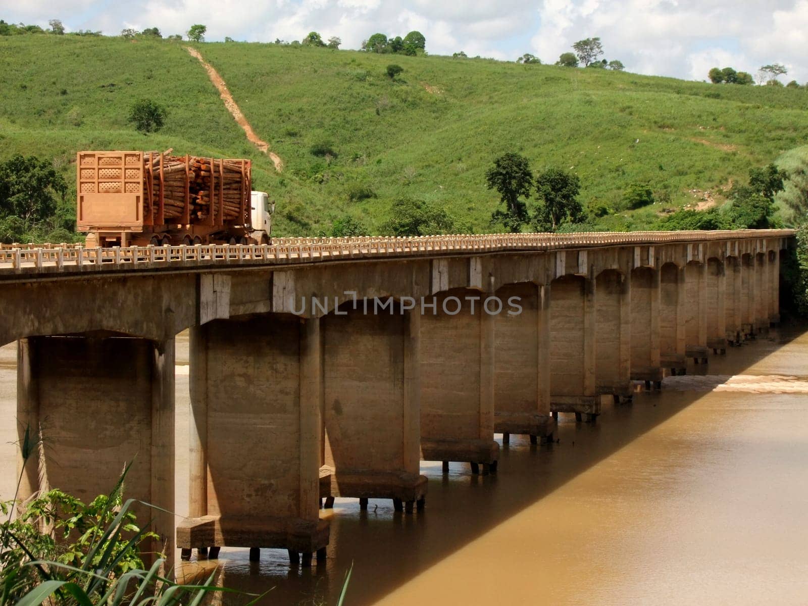 itapebi, bahia / brazil - april 5, 2011: vehicles are seen crossing the bridge over the Jequitinhonha River on the BR 101 road in the city of Itapebi, in southern Bahia.