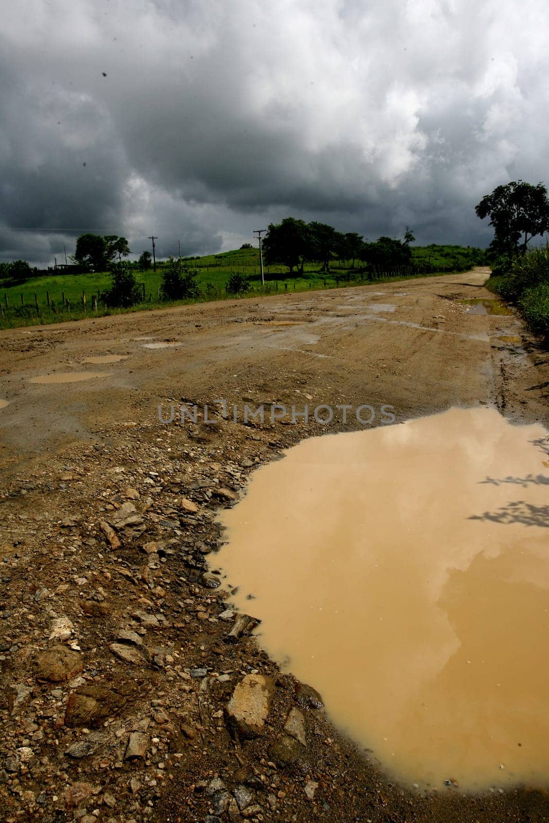 itabuna, bahia / brazil - november 22, 2011: mud and burco are seen on a dirt road leading to the district of Itamaraca, in the municipality of Itabuna, in southern Bahia......