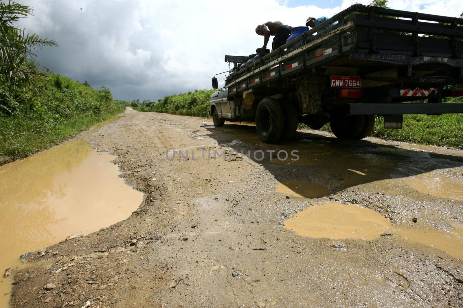 itabuna, bahia / brazil - november 22, 2011: mud and burco are seen on a dirt road leading to the district of Itamaraca, in the municipality of Itabuna, in southern Bahia......