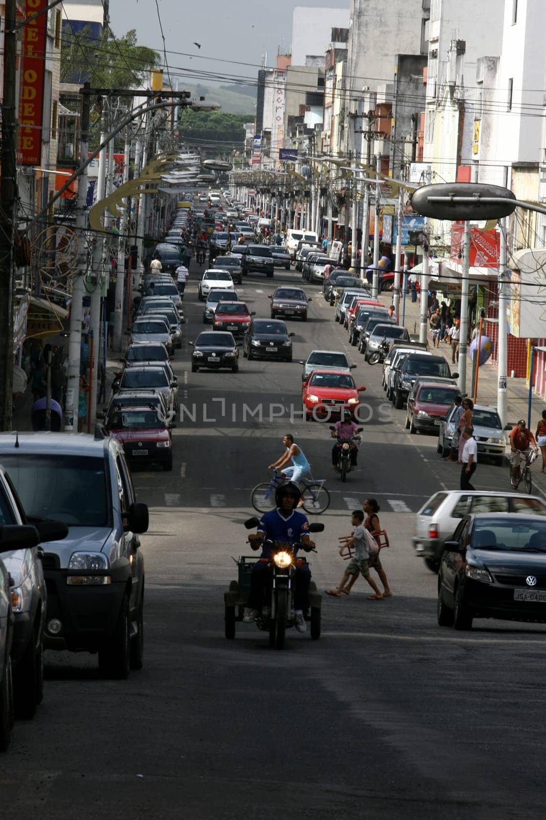 itabuna, bahia / brazil - january 2, 2012: vehicles are seen on the avenue Cinquentenario in the center of Itabuna, southern Bahia.