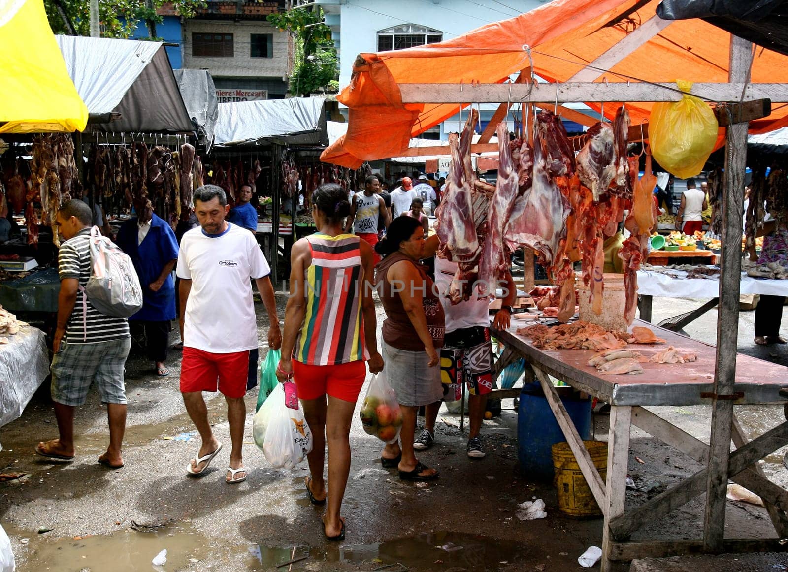 itabuna, bahia / brazil - november 26, 2011: bolvina and pork meat are seen hanging in the stalls, without refrigeration at the Sao Caetano fair in the city of Itabuna..