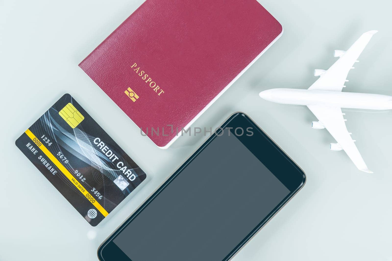 Smart phone, passport, credit card, on white background, Traveling concept