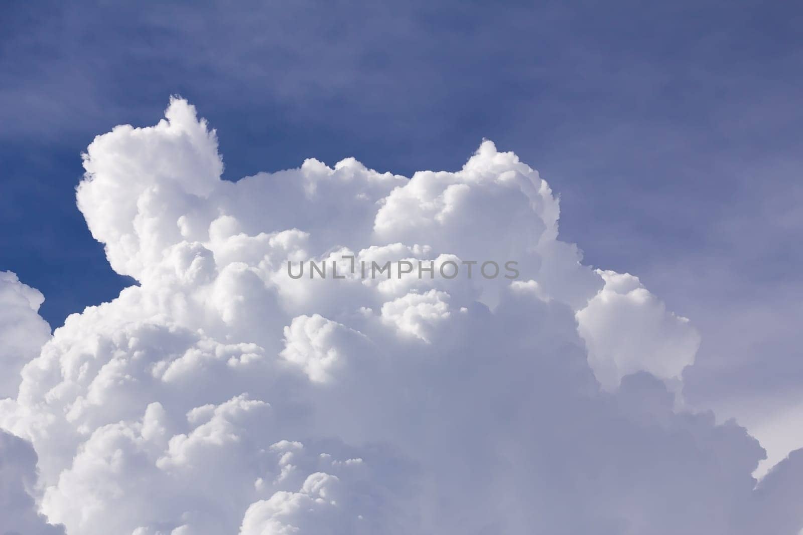 White clouds closeup in blue sky before rain