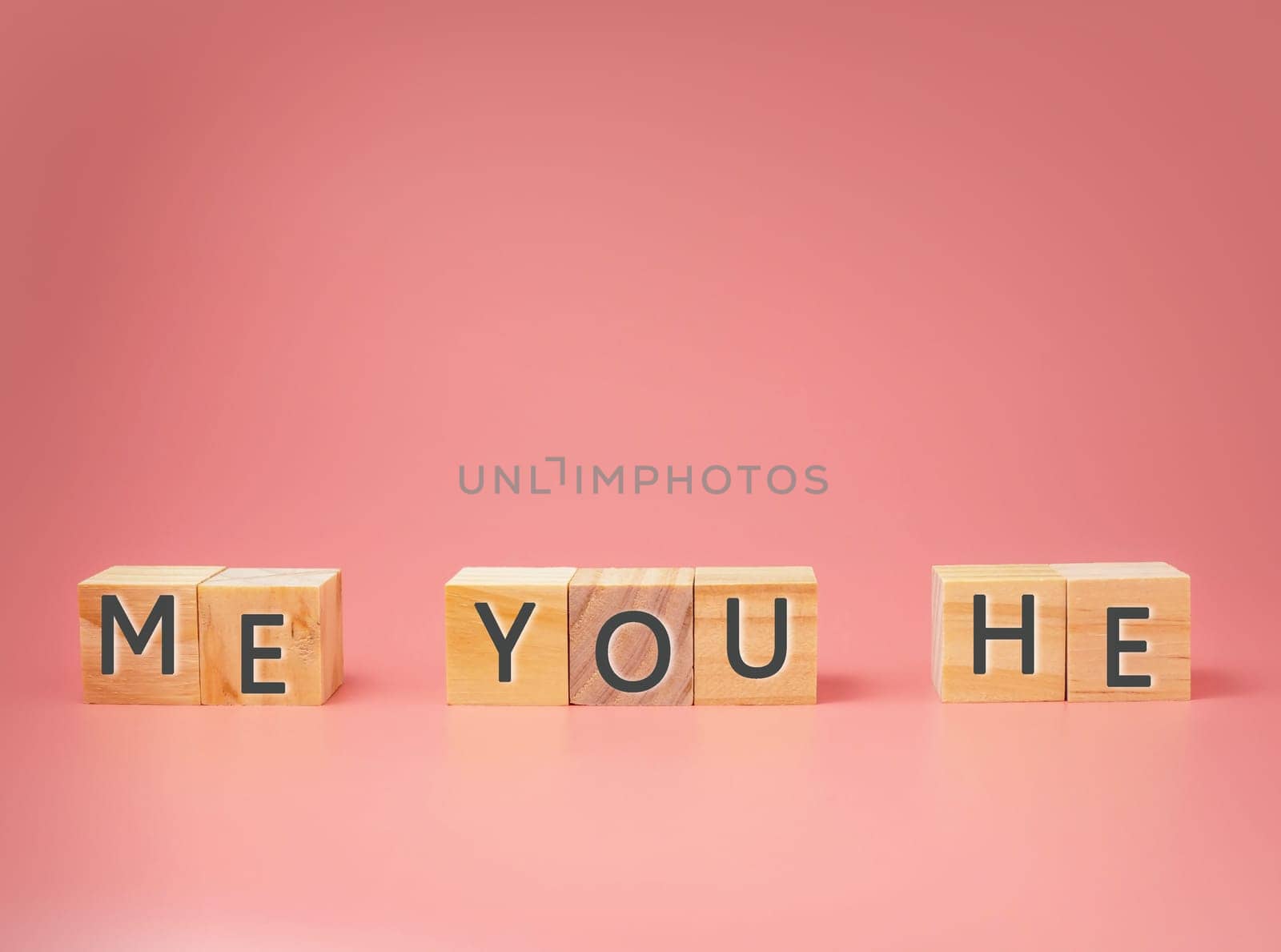 The concept of love on wooden blocks with pink background