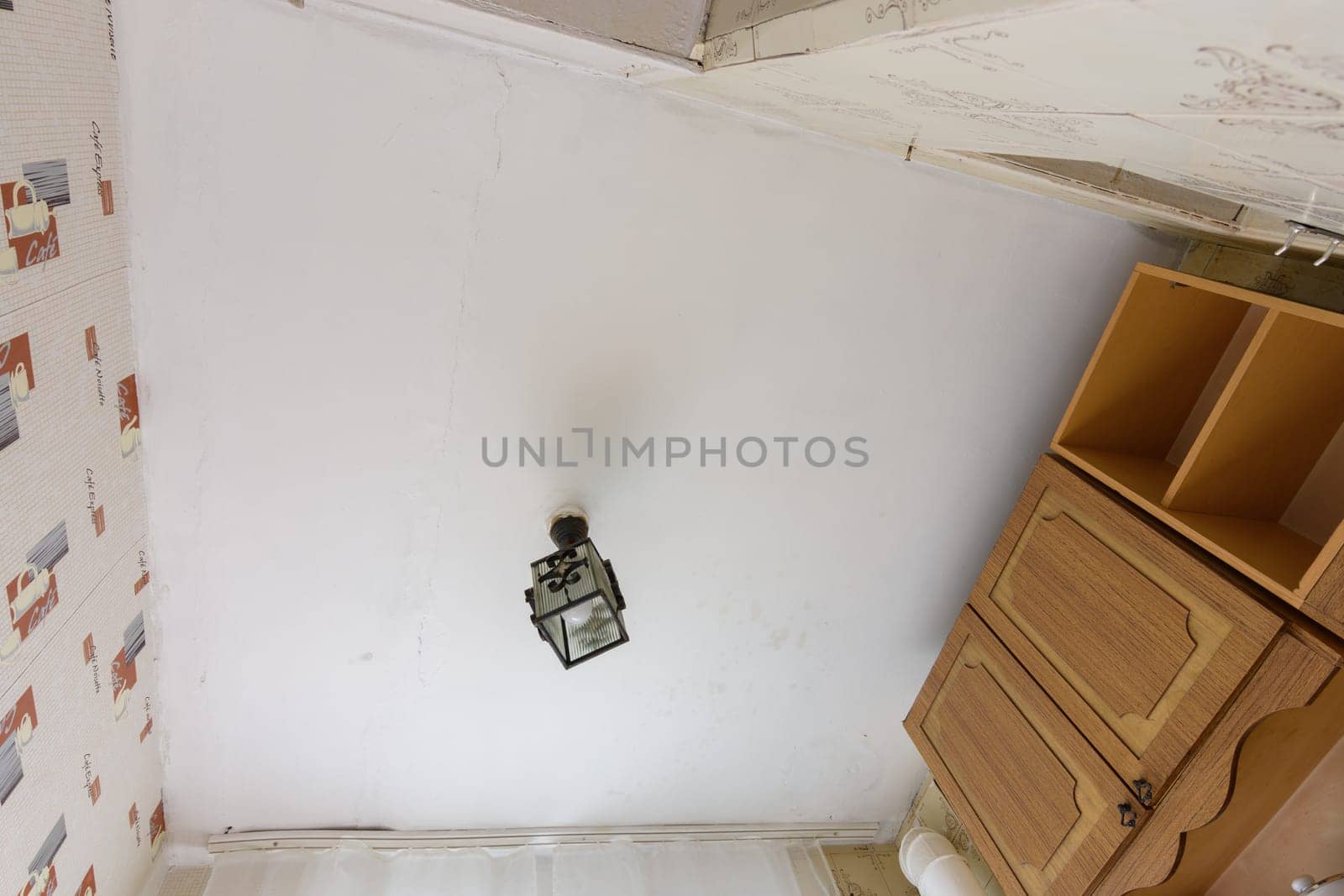 Anapa, Russia - June 25, 2020: Old plastered ceiling in the kitchen in need of renovation