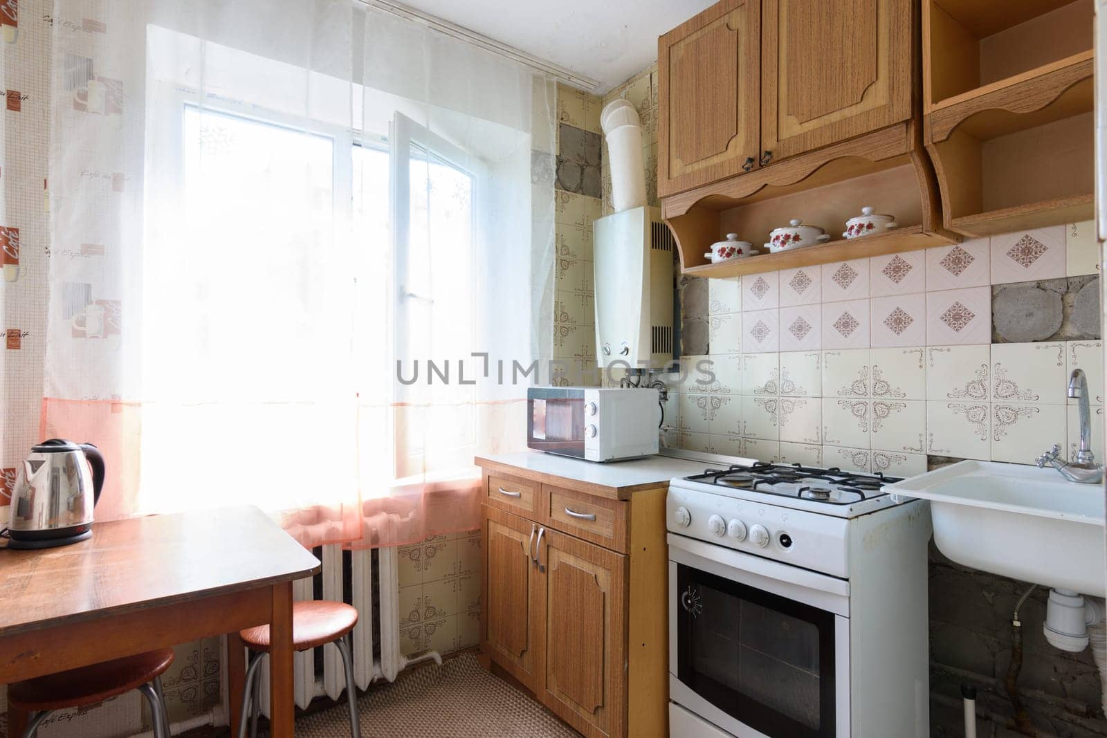 Anapa, Russia - June 25, 2020: Old kitchen in a small apartment requiring major renovation