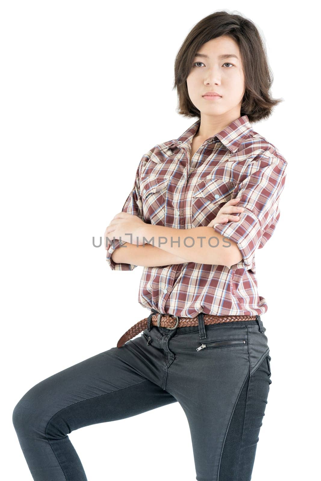 Young pretty woman in a cowboy hat and plaid shirt with arms crossed isolated on white background