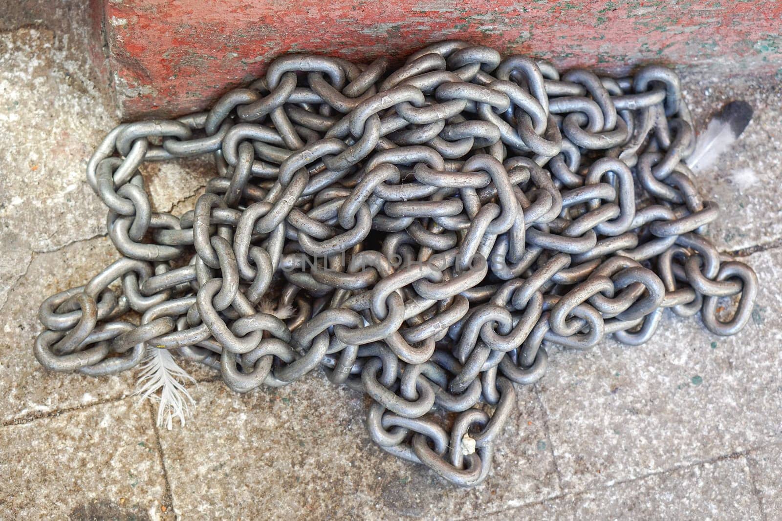 Heavy weight steel chains at floor