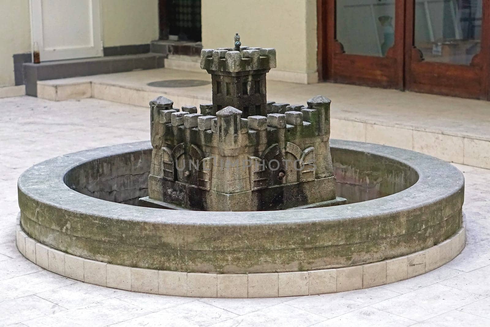 Round fountain in castle fortification shape