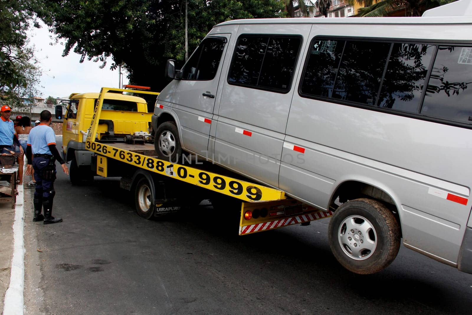 salvador, bahia / brazil - april 7, 2013: winch is seen picking up van parked in a prohibited place in the city of Salvador.
