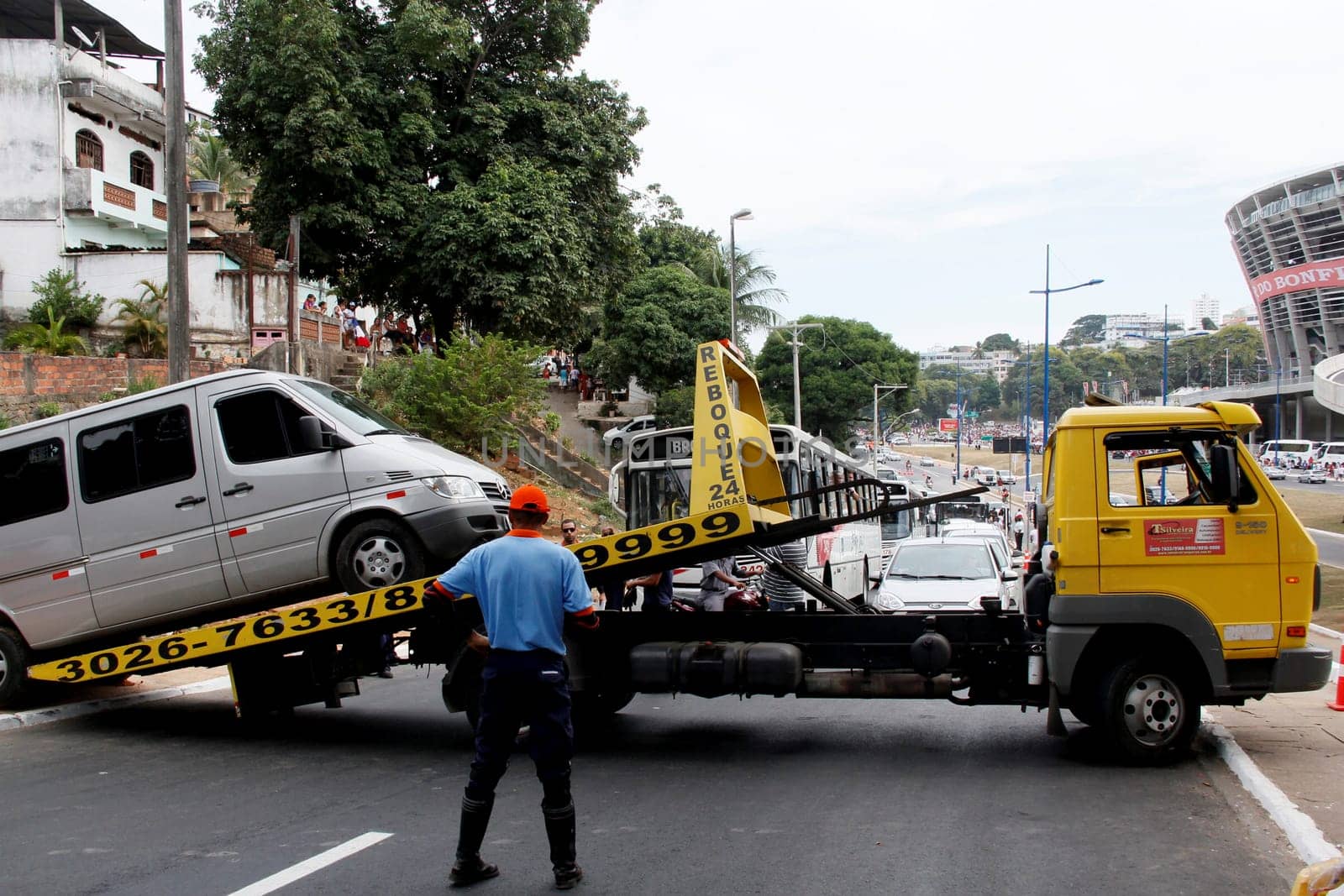 salvador, bahia / brazil - april 7, 2013: winch is seen picking up van parked in a prohibited place in the city of Salvador.