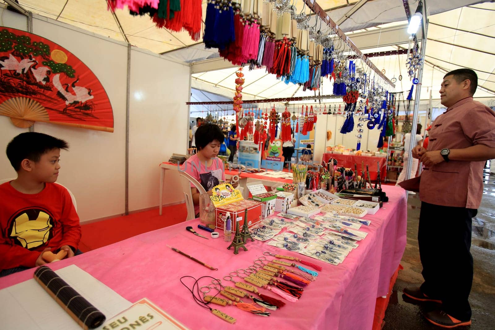 salvador, bahia / brazil - august 27, 2016: people are seen in store stand during japanese culture party at Parque de Exposicoes in the city of Salvador.