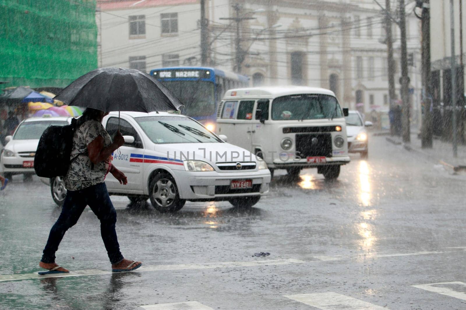 salvador, bahia / brazil - august 26, 2016: People are seen using umbrella during rain in the city of Salvador.