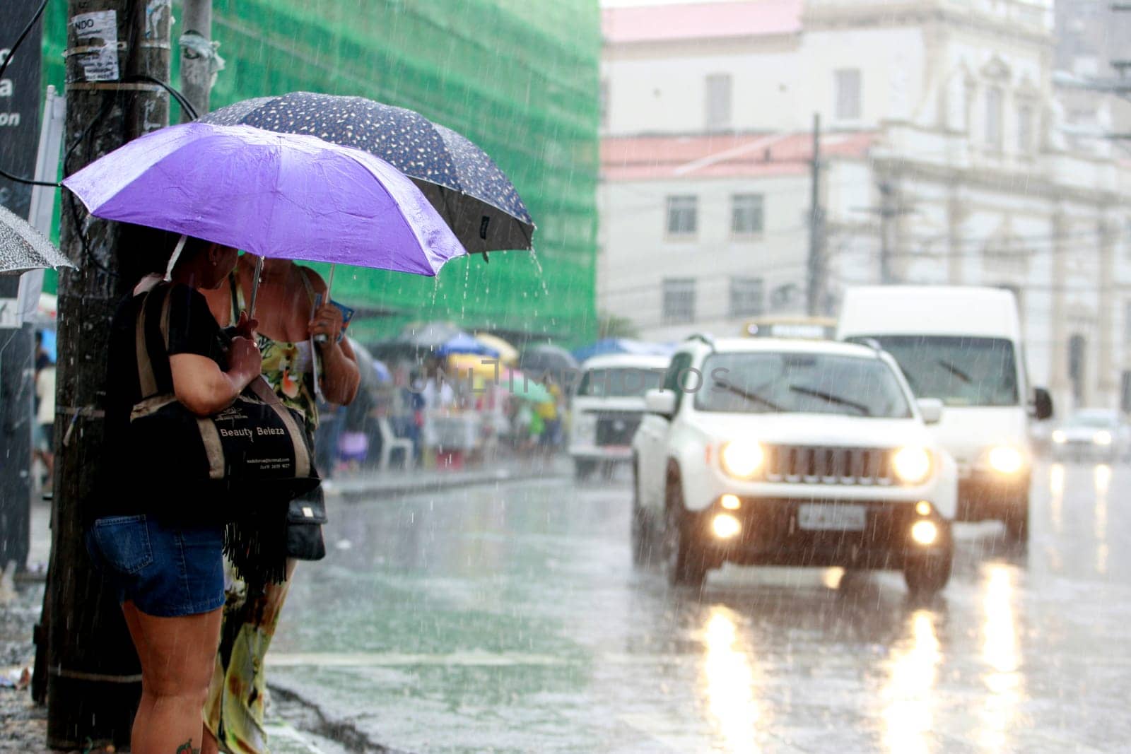 salvador, bahia / brazil - august 26, 2016: People are seen using umbrella during rain in the city of Salvador.
