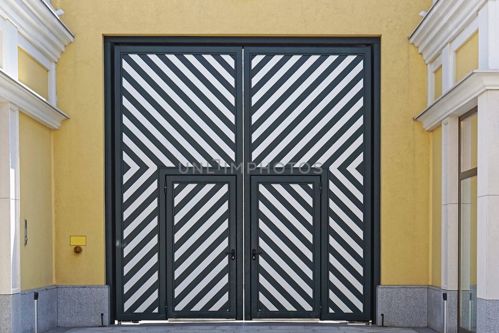 Big double door with diagonal stripe lines