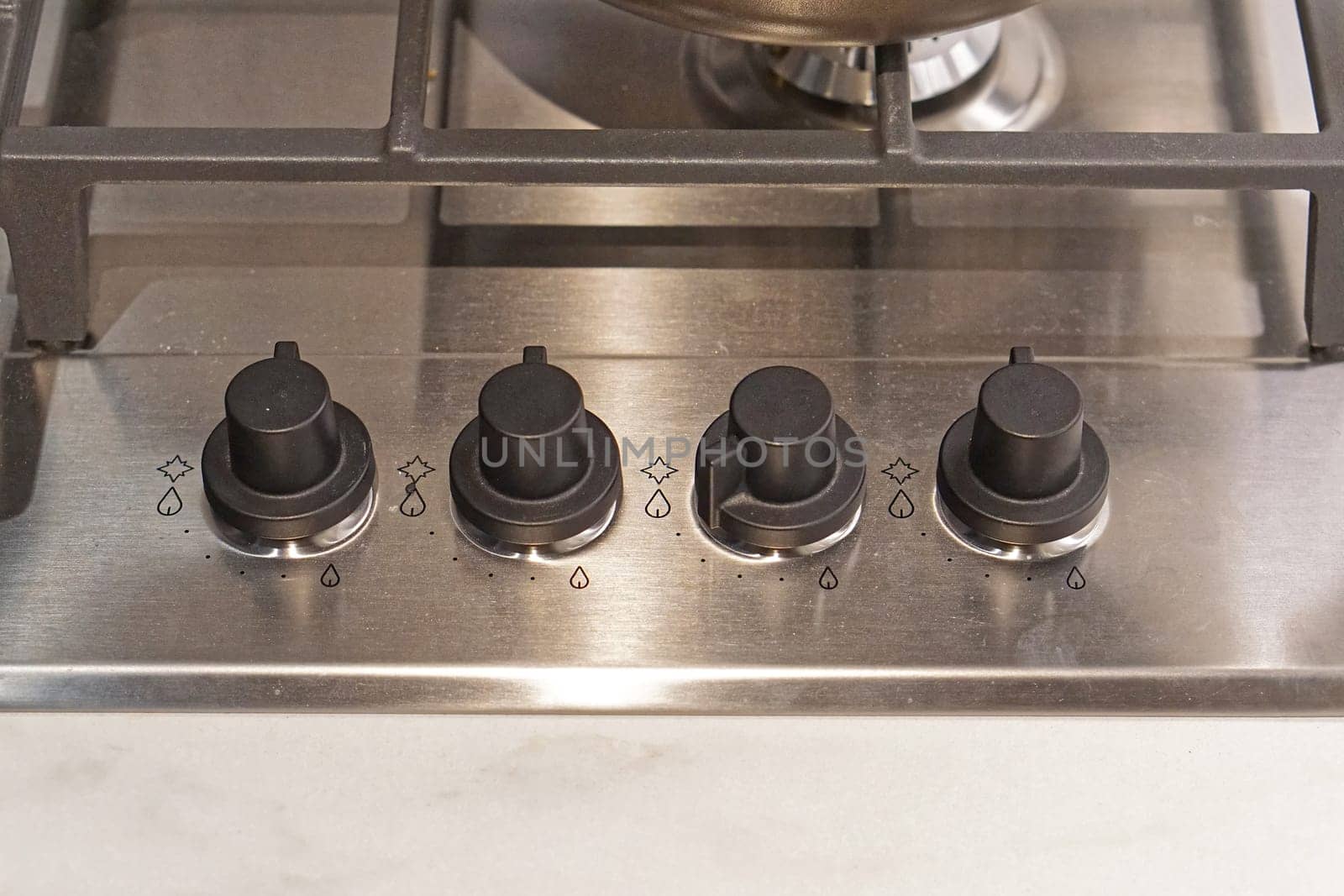 Four controls buttons at gas burning stove