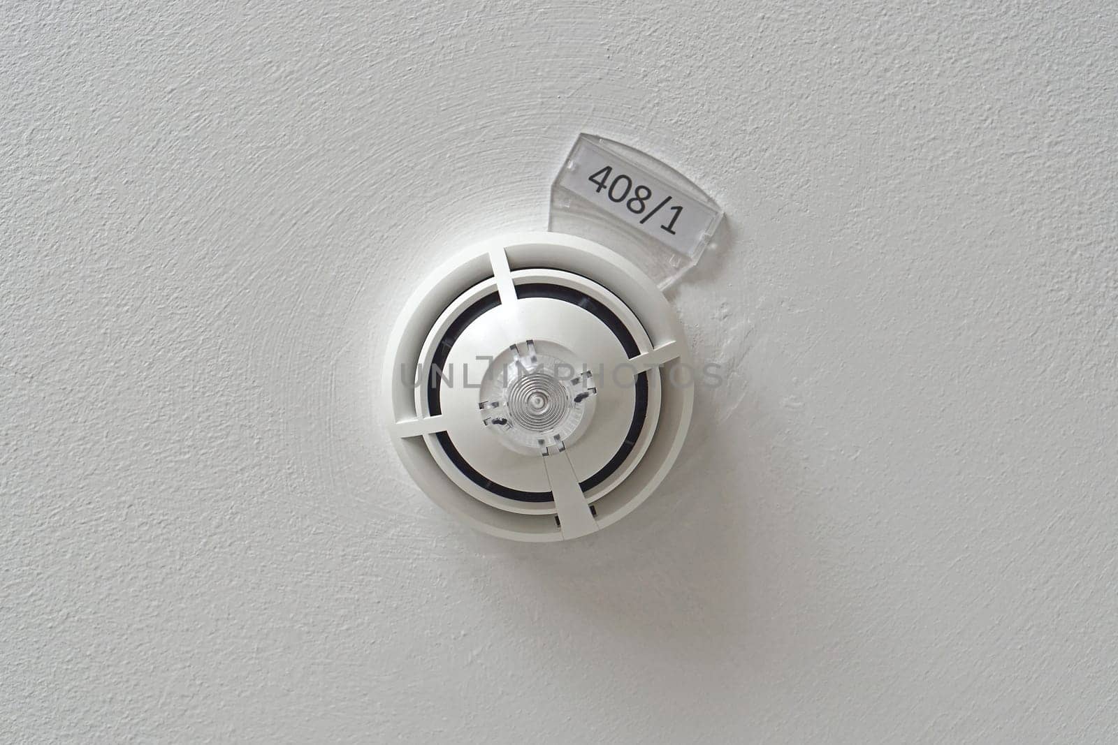 Smoke and fire detector at ceiling