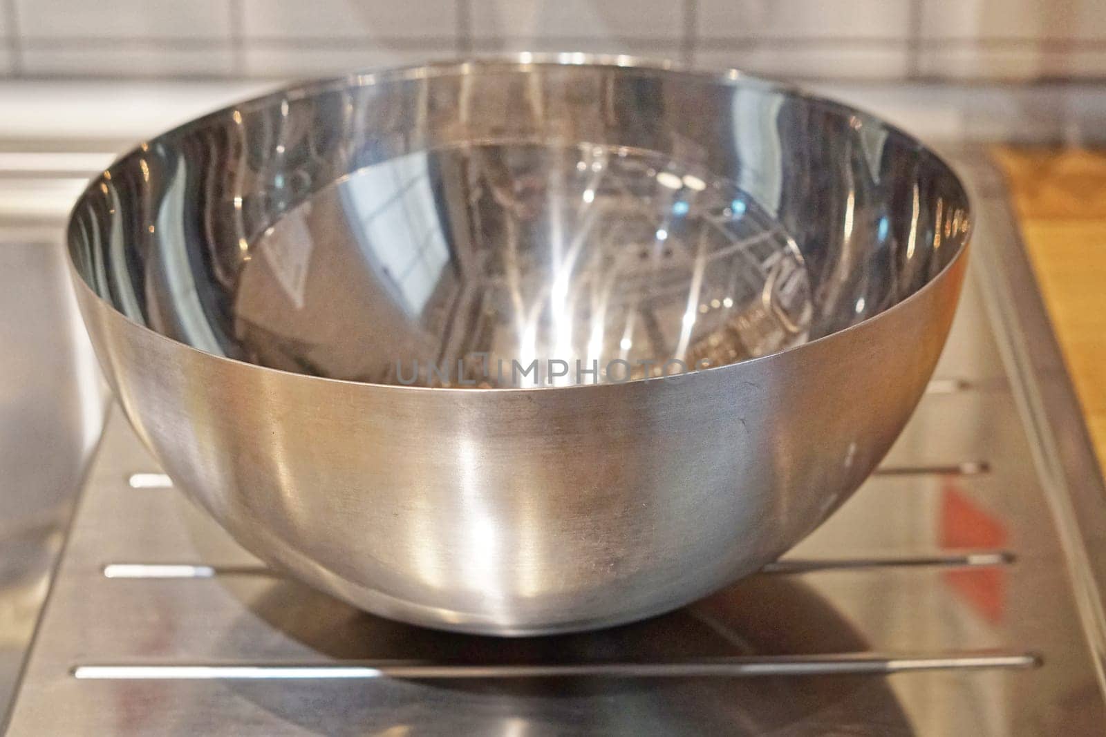 Metal bowl for preparing food in kitchen