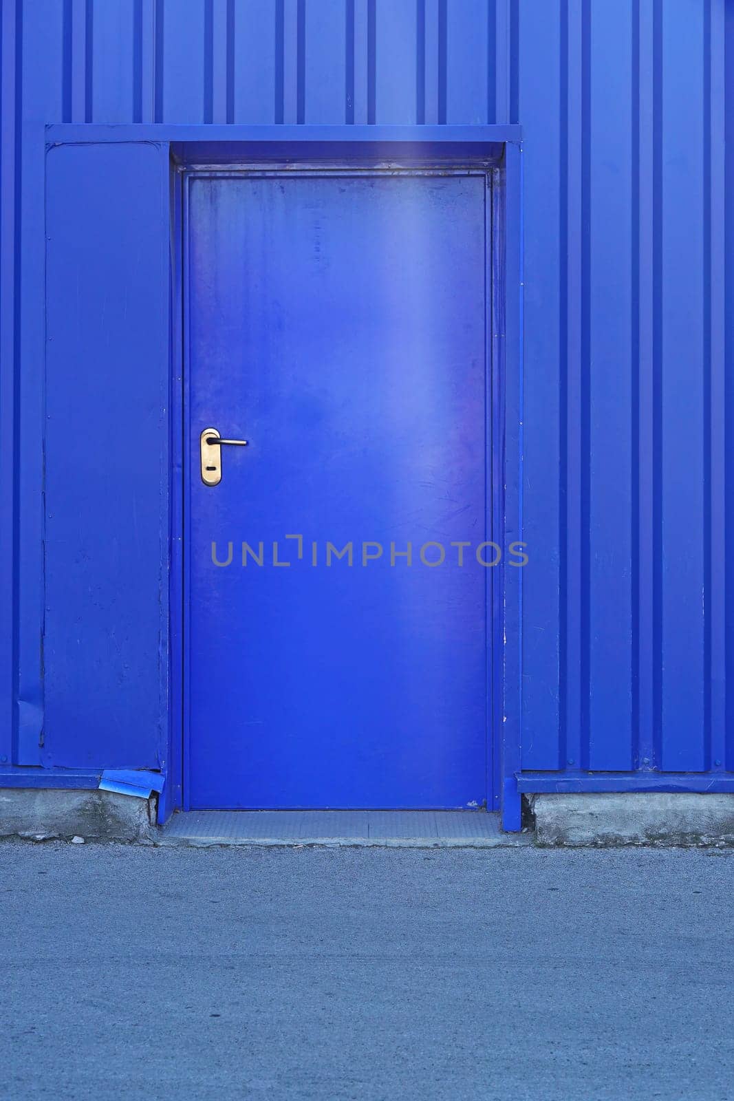 Blue door at industrial building exterior