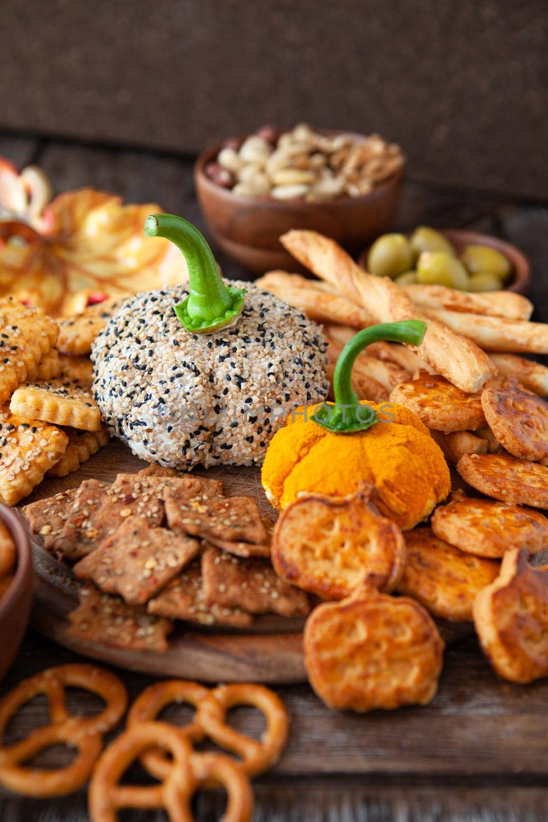 Cheese platter with cream cheese, crackers and nuts
