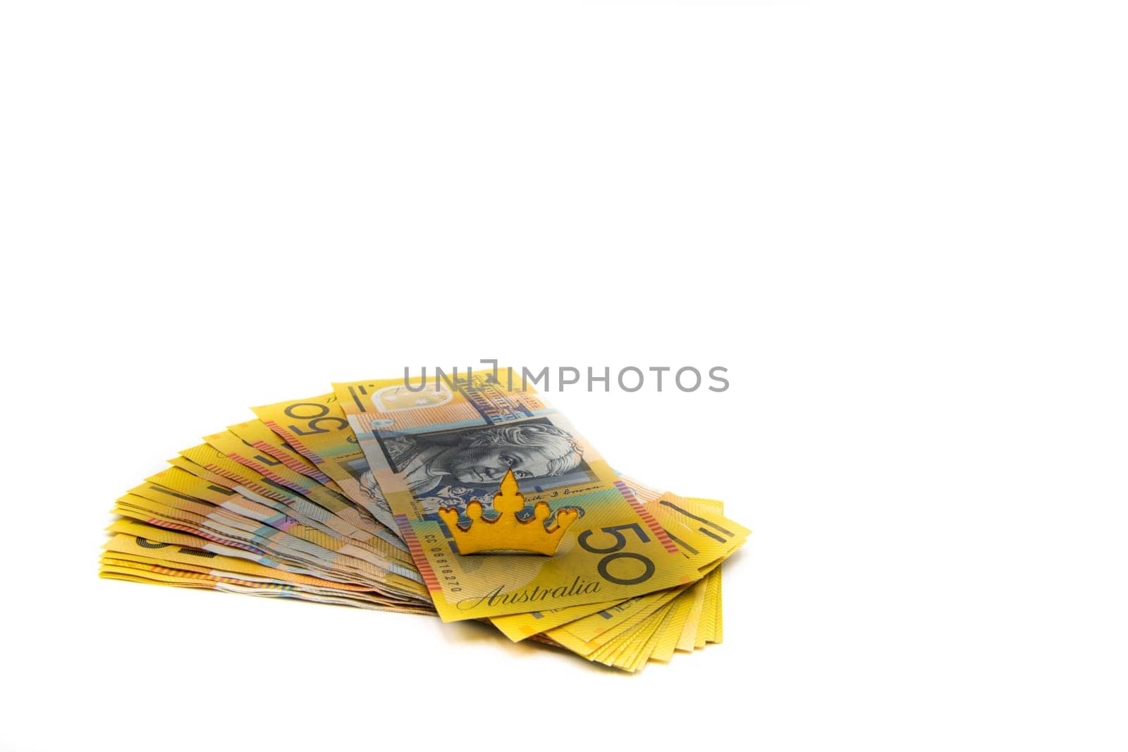Stack of Australian 50 dollars banknotes isolated over white background with copy space, cash is king concept image
