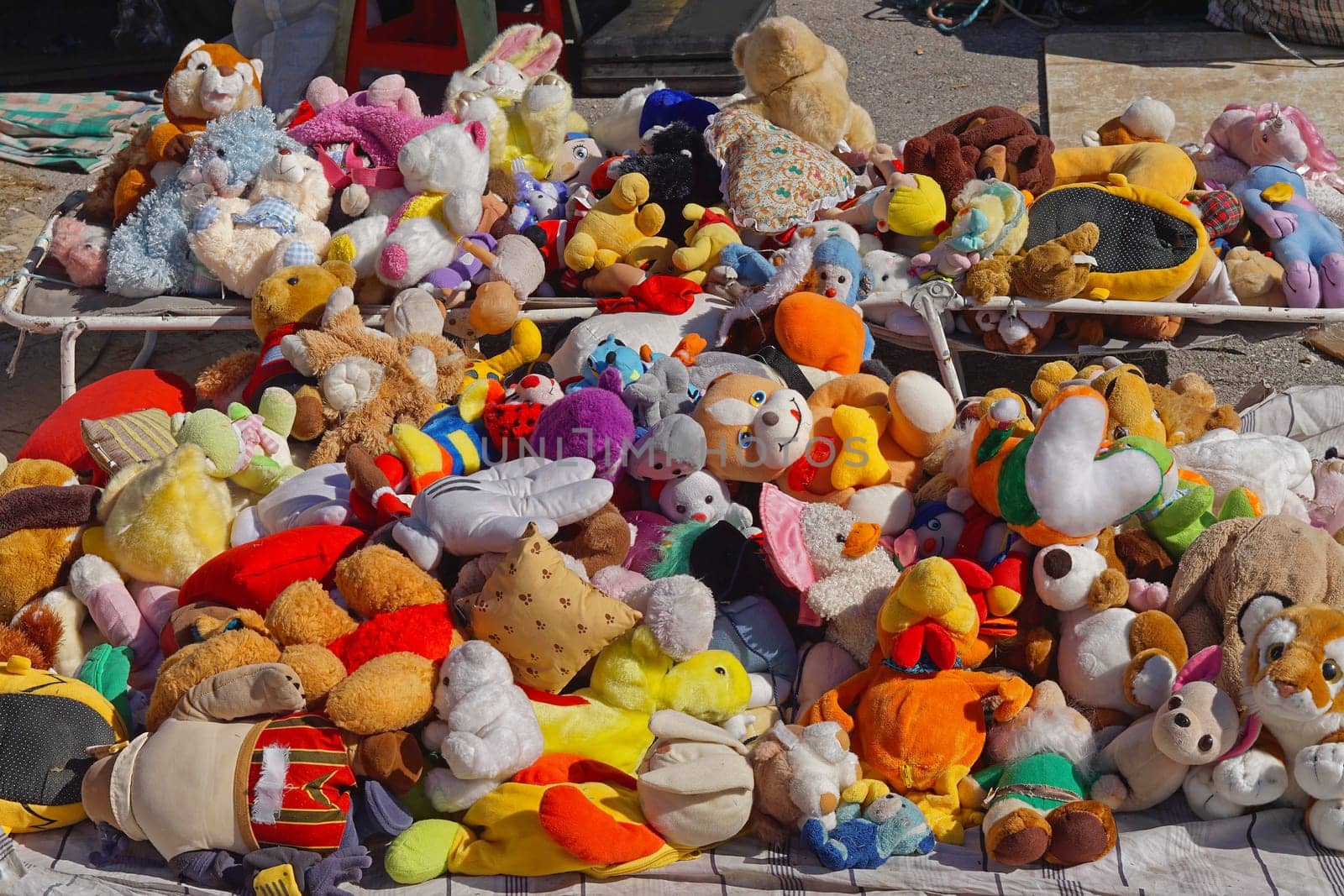 Big bunch of used old toys at flea market