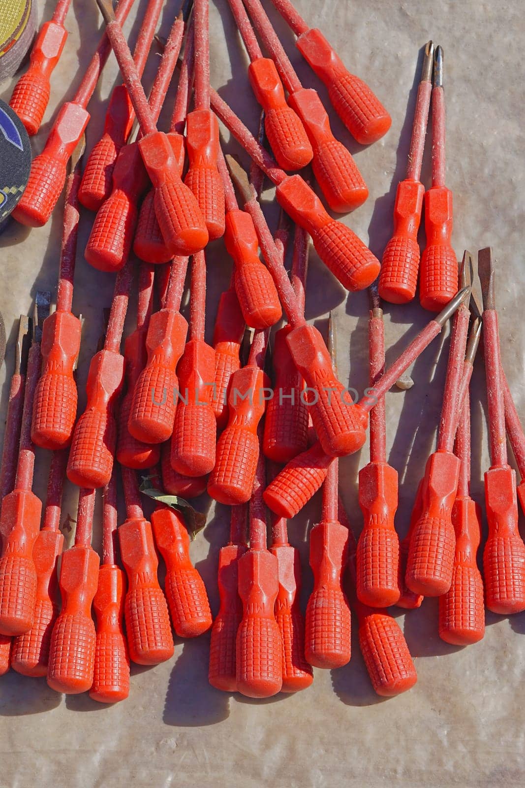 Big bunch of red screwdrivers with insulation protection