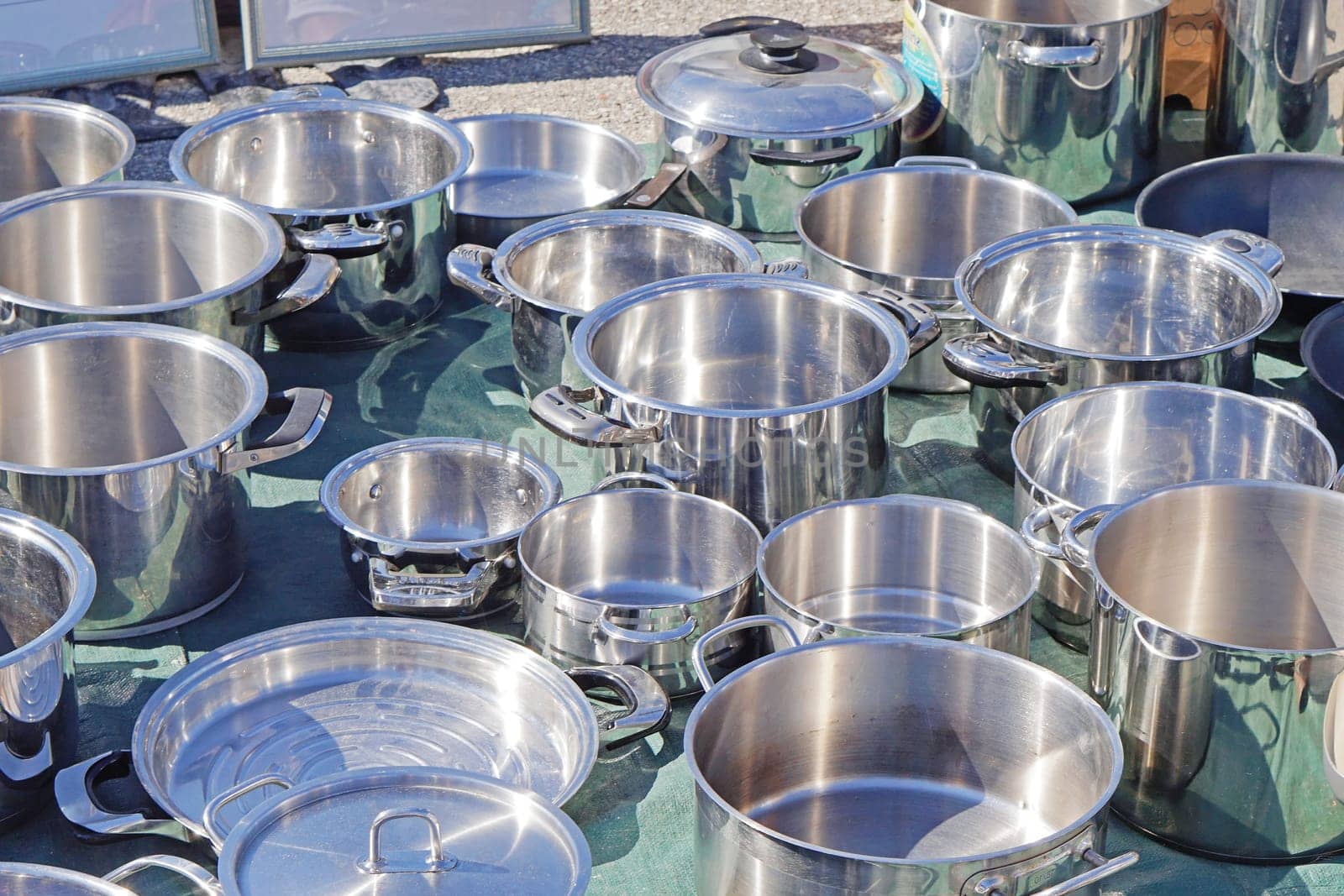 Many stainless steel metal cooking pots