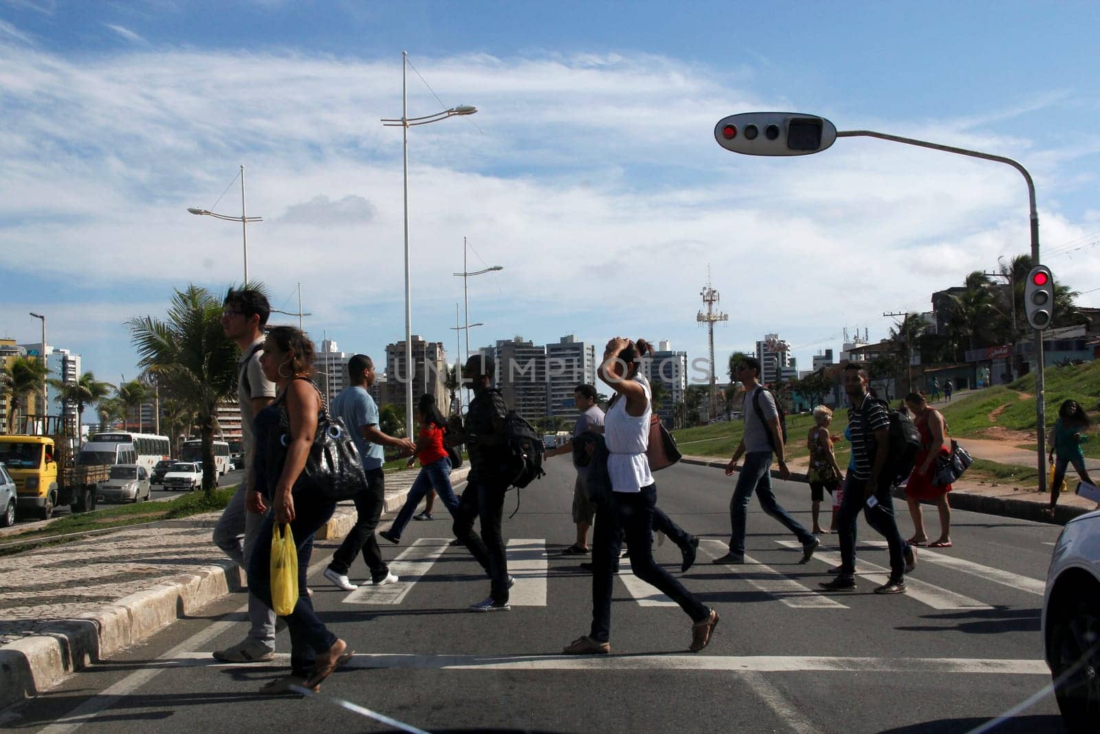 salvador, bahia / brazil - may 8, 2013: people are seen crossing the street in a pedestrian lane in the city of Salvador, Bahia.