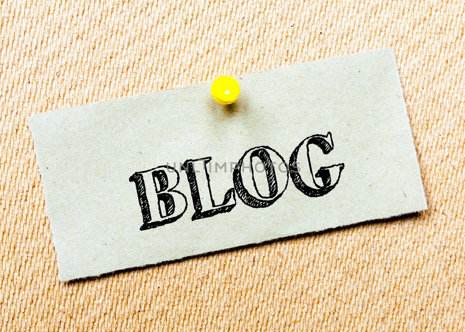 Recycled paper note pinned on cork board. Blog message. Concept Image