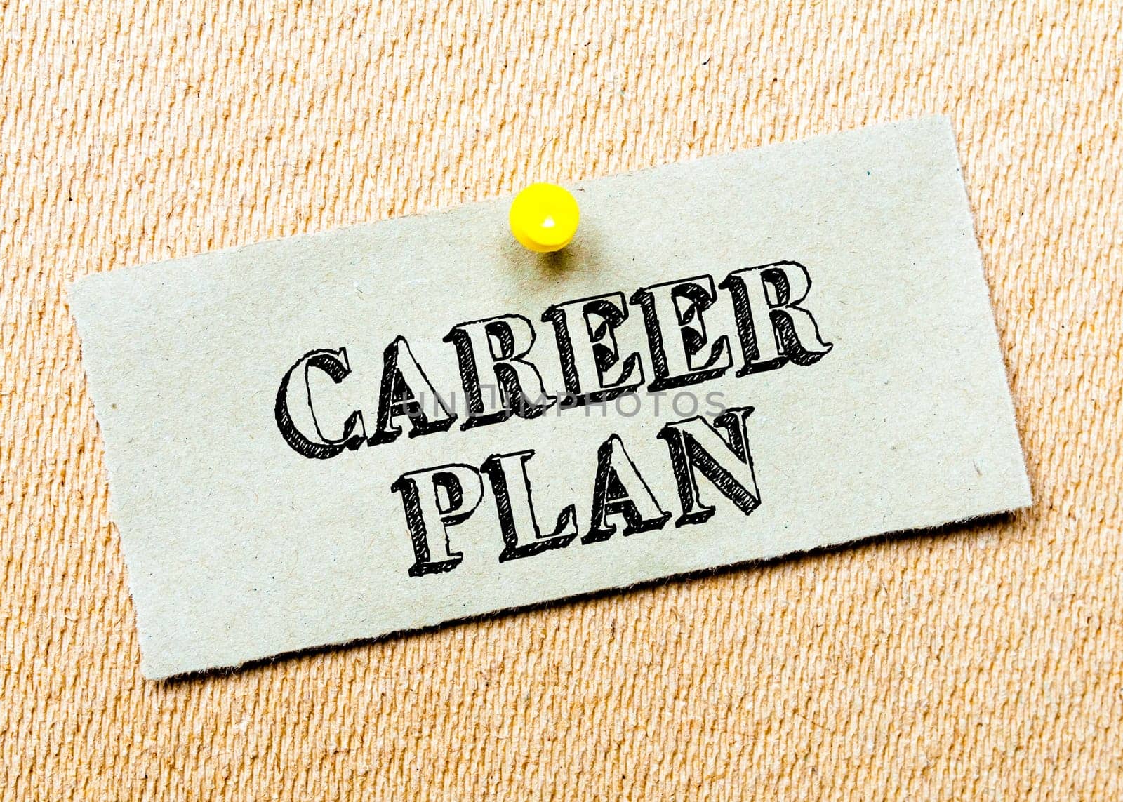 Recycled paper note pinned on cork board.Career Plan Message. Concept Image