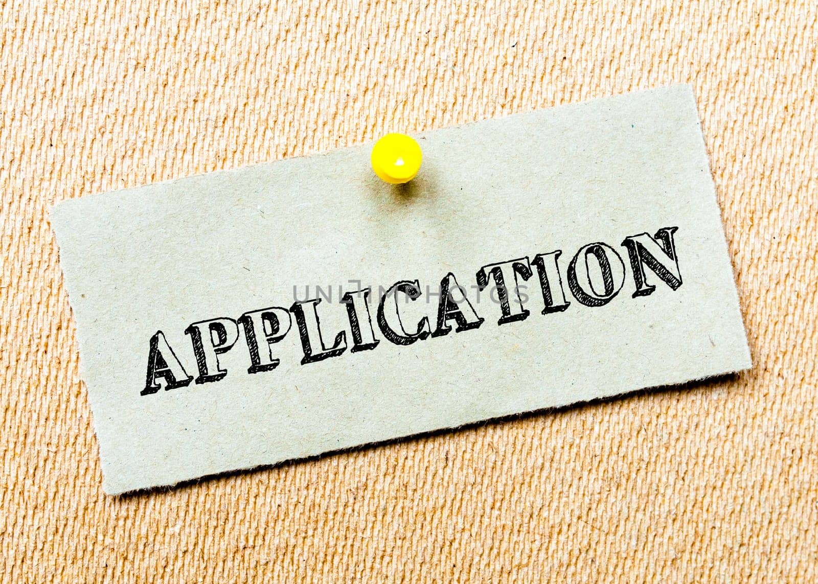 Recycled paper note pinned on cork board. Application message. Concept Image