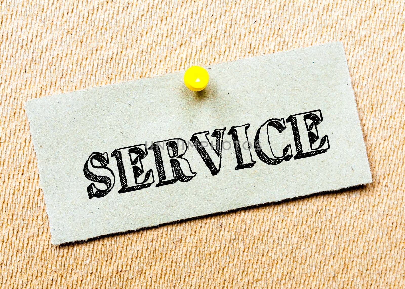Recycled paper note pinned on cork board. Service Message. Concept Image