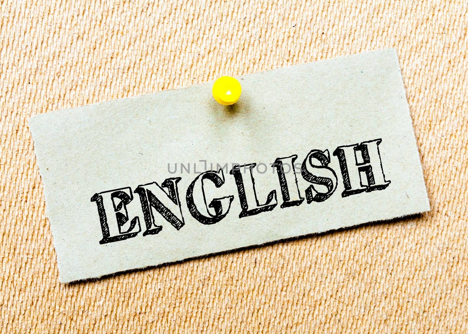 Recycled paper note pinned on cork board. English Message. Concept Image