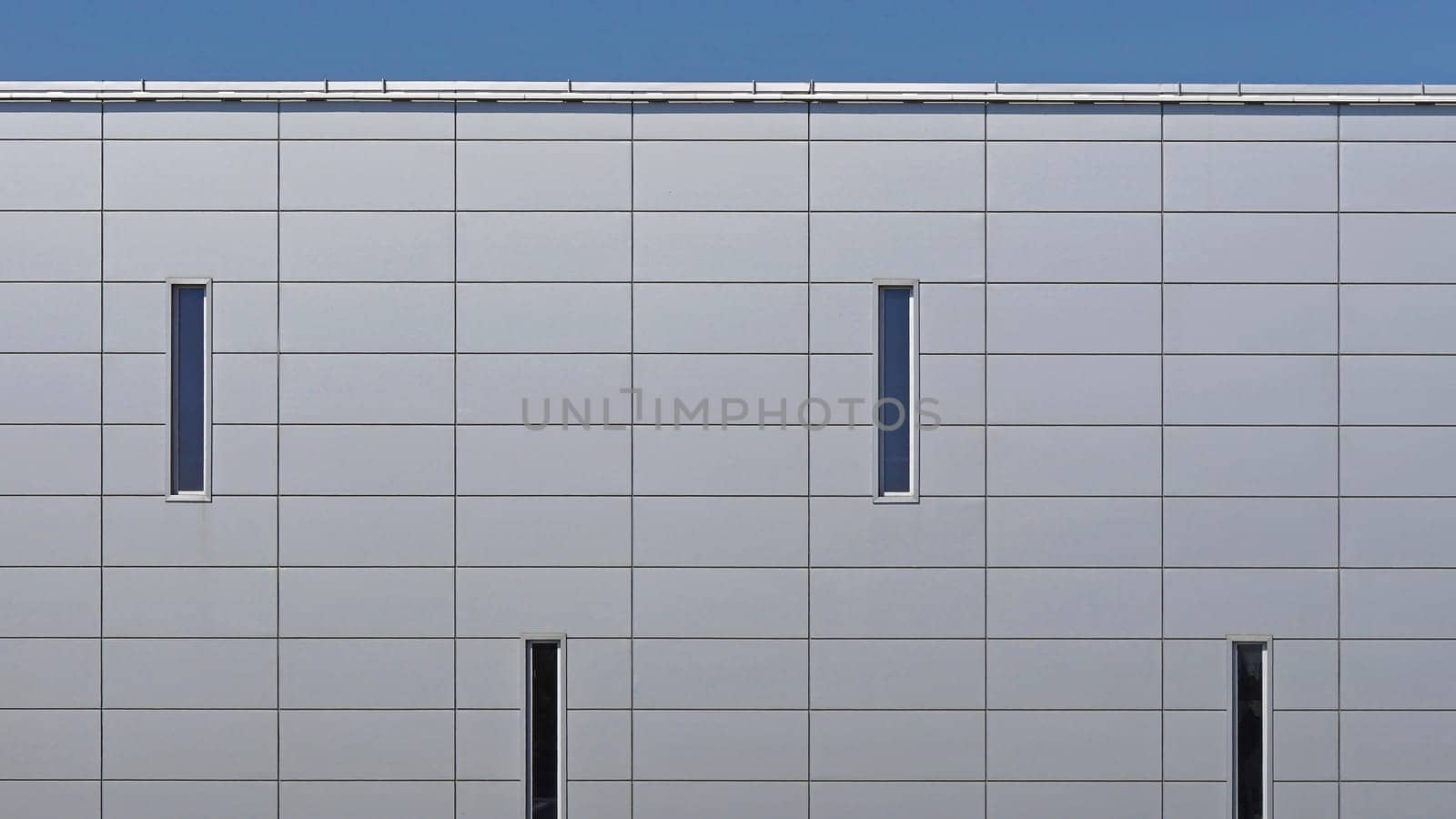 Grey metal panels at commercial building exterior