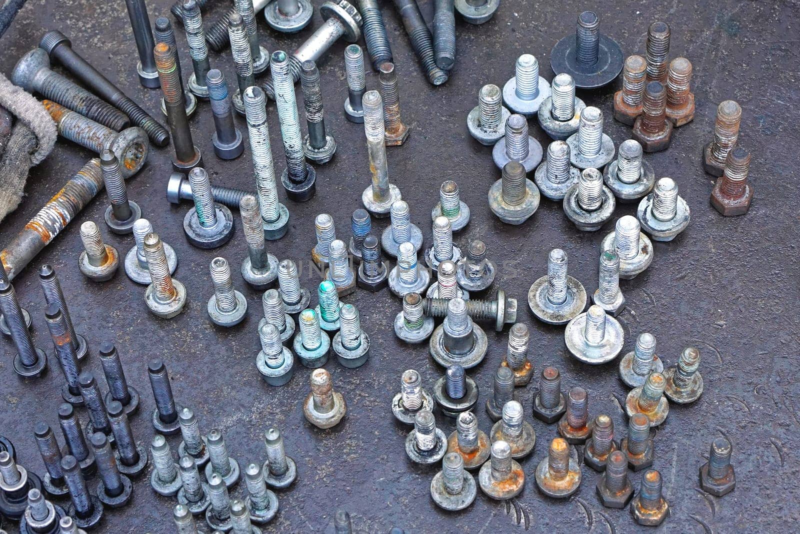 Used screws and nuts in upright position