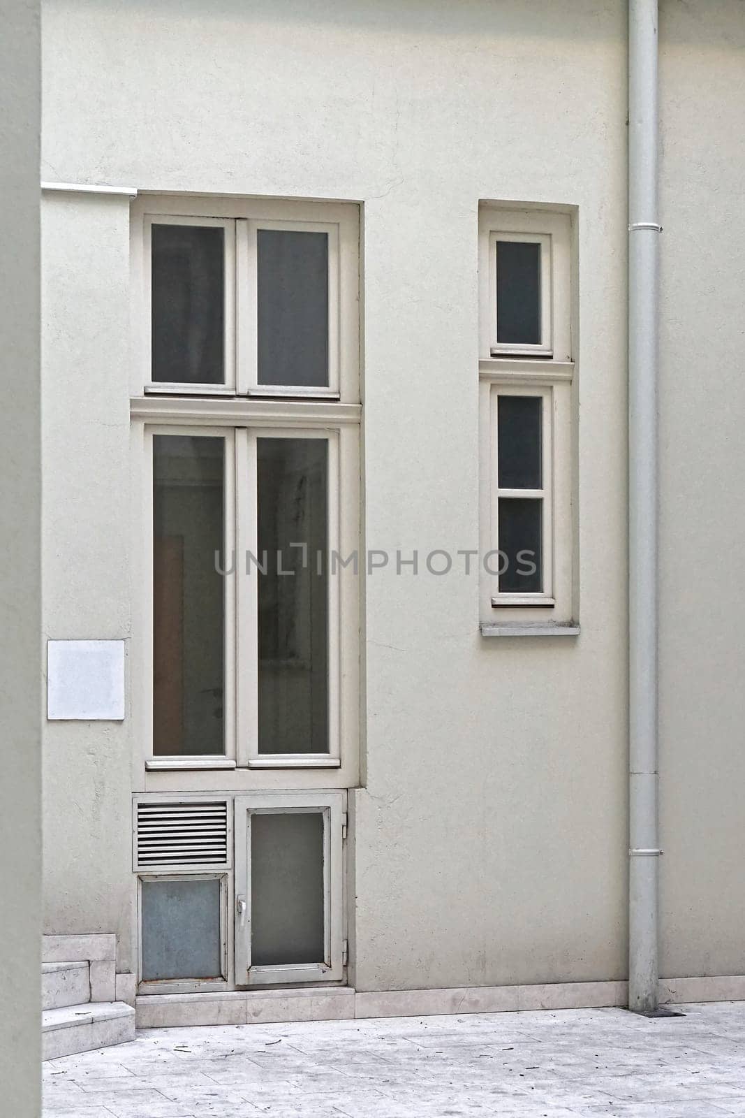 Long vertical windows at white building