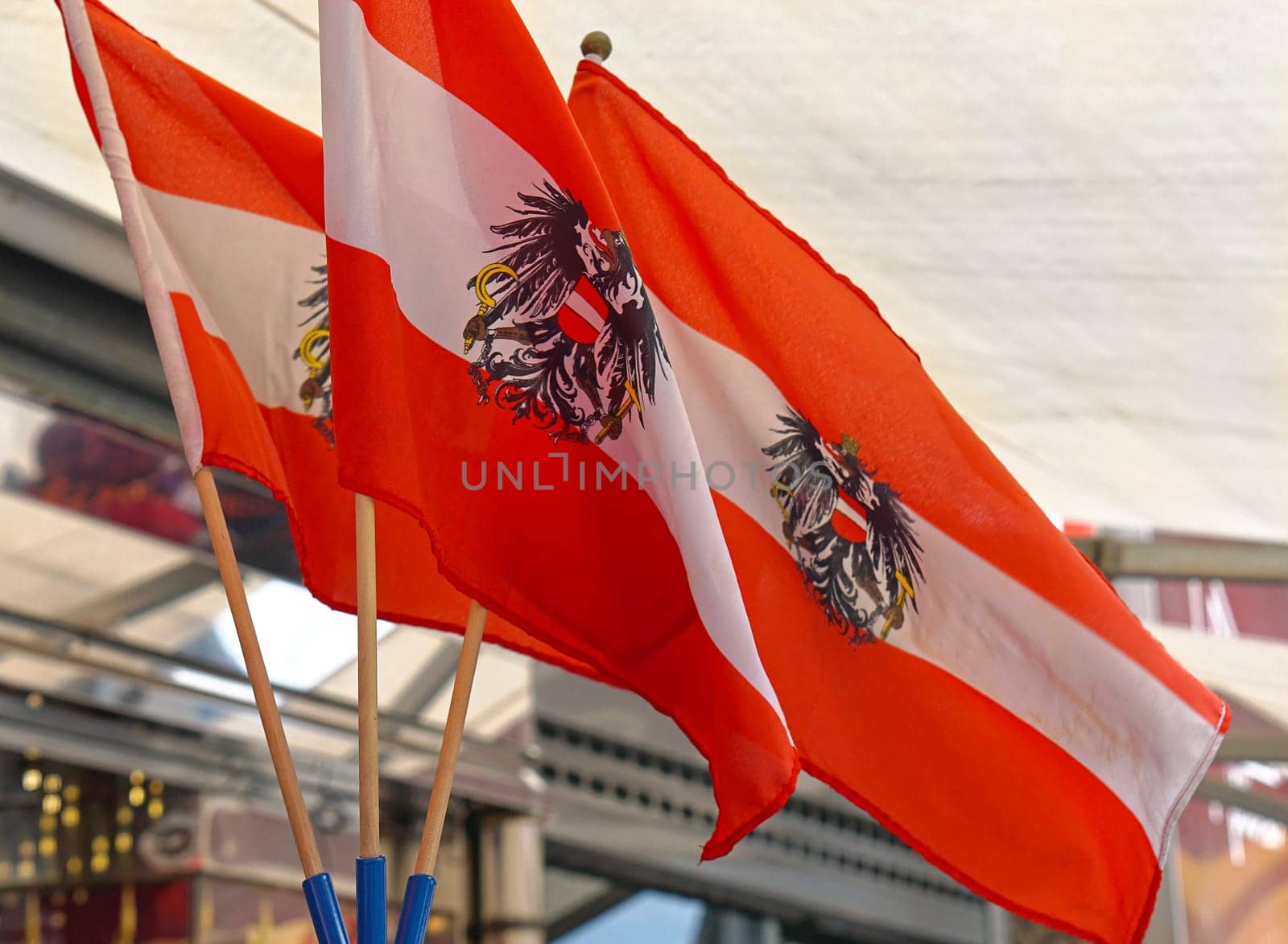 Three Austrian flags with eagles