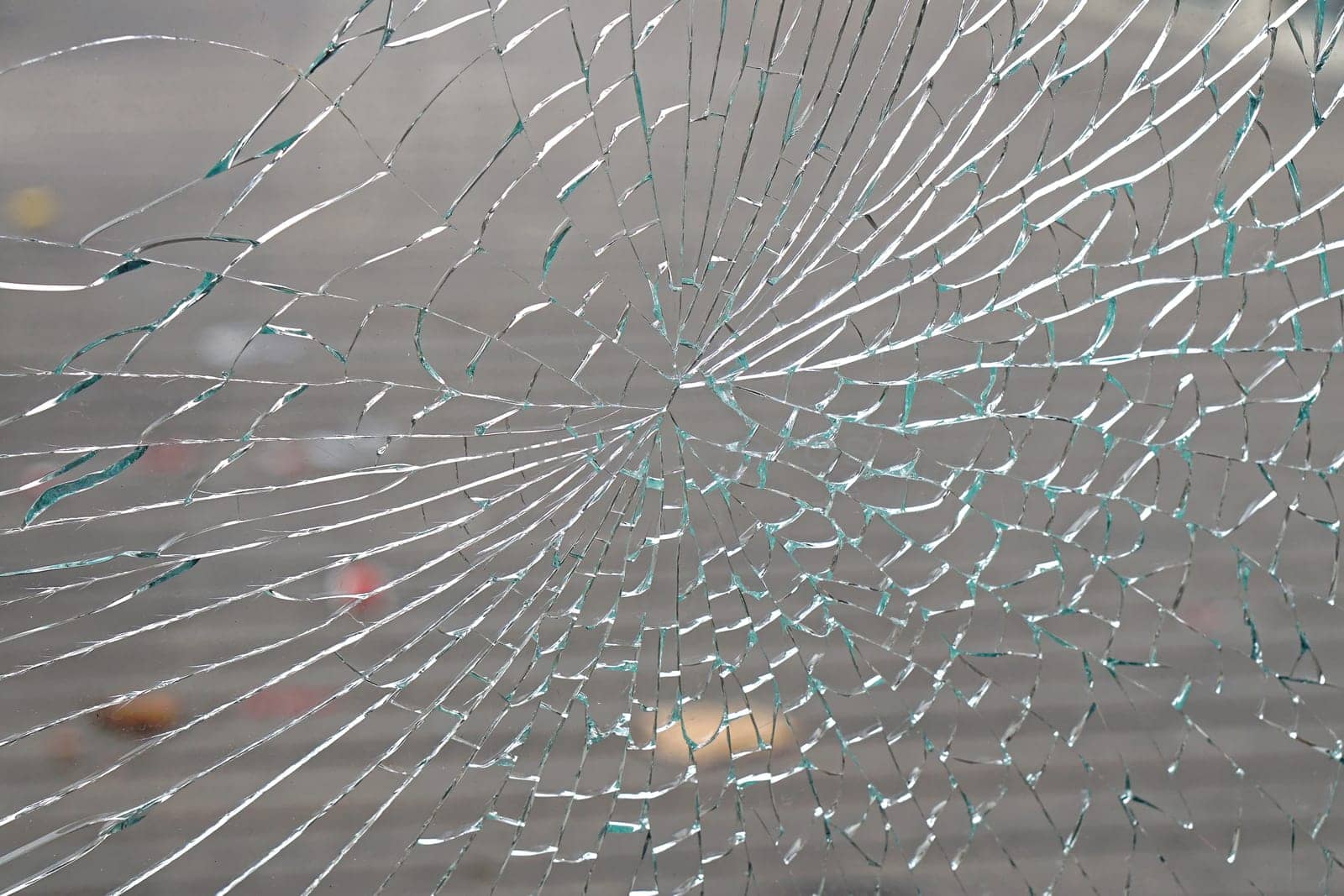 Broken window and cracked glass damage