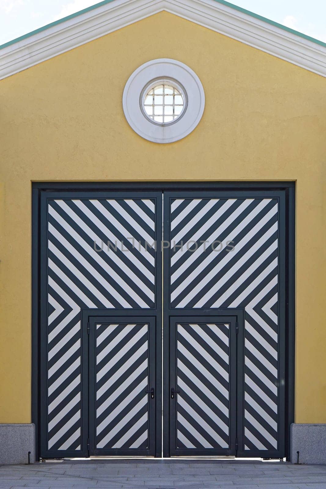 Big double door with diagonal stripe lines