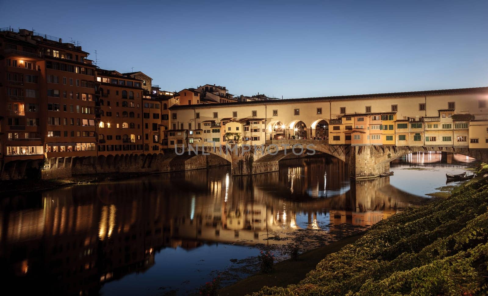 View of the Ponte Vecchio or Old Bridge across the Arno River in Florence, Italy at night